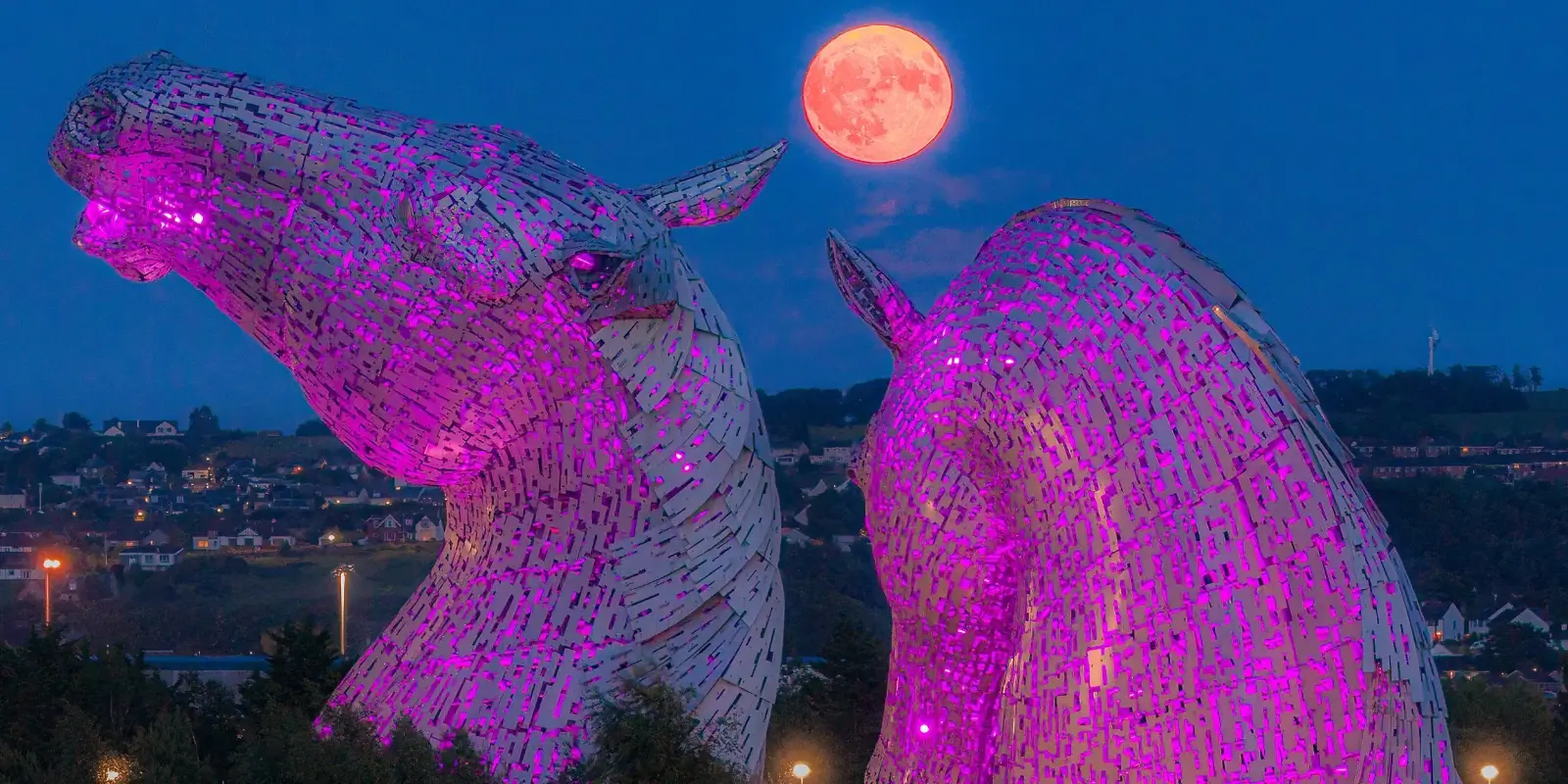 The Kelpies lit up at night